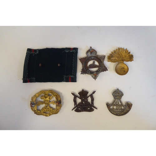 220 - Approximately twenty-five military metal helmet plates and badges, some copies: to include Indian Ar... 