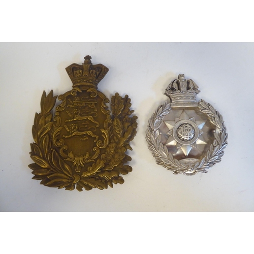 220 - Approximately twenty-five military metal helmet plates and badges, some copies: to include Indian Ar... 