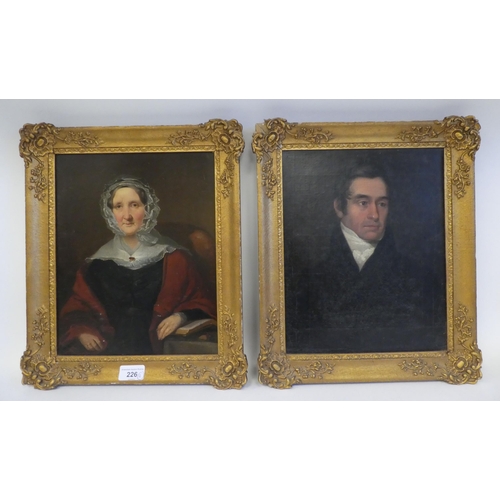 226 - A mid 19thC portrait of Rev. John Kennedy; and another of his mother  both oil on board  10