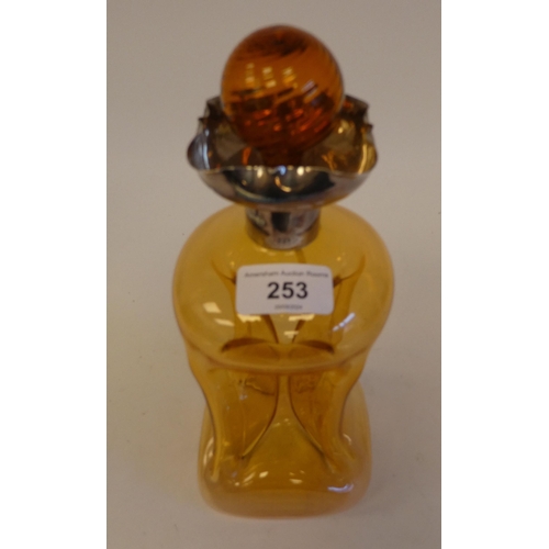 253 - A late Victorian amber tinted glass cluck-cluck decanter with a stopper and silver collar  Sheffield... 