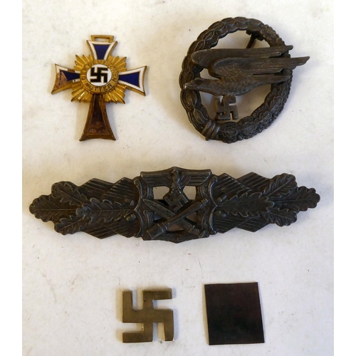 256 - Three German military badges(Please Note: this lot is subject to the statement made in the Auctionee... 