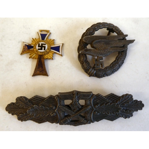 256 - Three German military badges(Please Note: this lot is subject to the statement made in the Auctionee... 