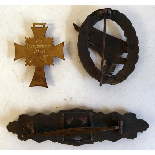 256 - Three German military badges(Please Note: this lot is subject to the statement made in the Auctionee... 