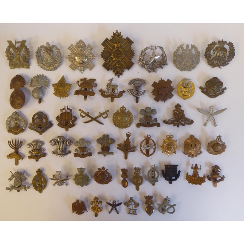 262 - Approximately fifty military metal cap badges, some copies: to include 'Isle of Man Home Guard'(Plea... 