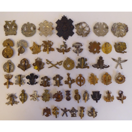 262 - Approximately fifty military metal cap badges, some copies: to include 'Isle of Man Home Guard'(Plea... 