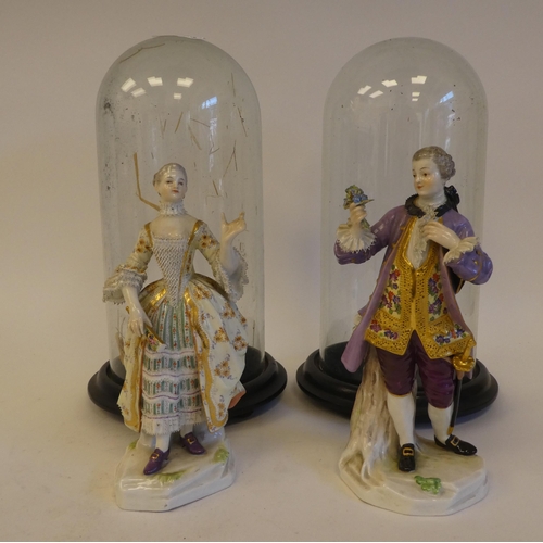 265 - A pair of mid 19thC Meissen porcelain figures, viz. a woman wearing a ballgown, holding a fan  impre... 