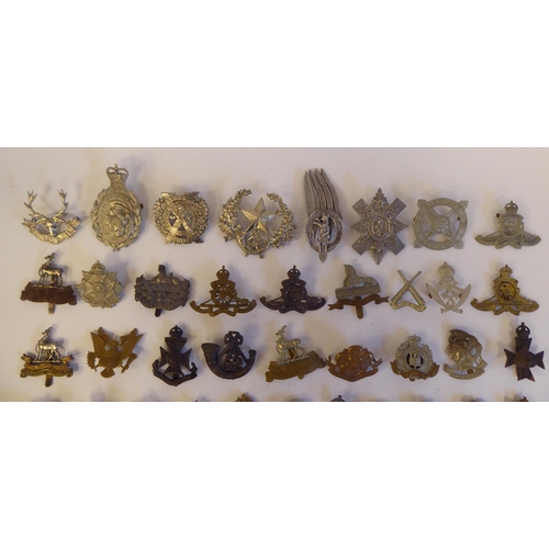 267 - Approximately fifty military metal cap badges, some copies: to include '5th London Brigade' (Pl... 