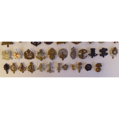 267 - Approximately fifty military metal cap badges, some copies: to include '5th London Brigade' (Pl... 