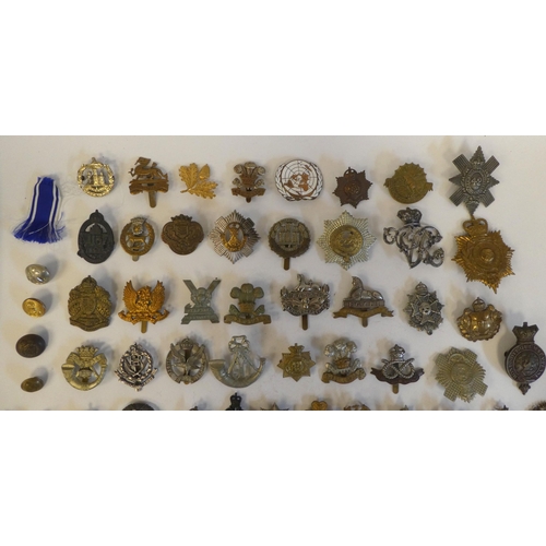 268 - Approximately seventy military metal cap badges, some copies: to include 'Egypt Gloucestershire Regi... 