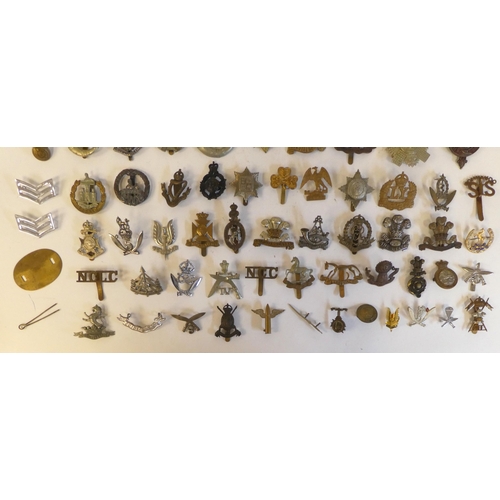 268 - Approximately seventy military metal cap badges, some copies: to include 'Egypt Gloucestershire Regi... 