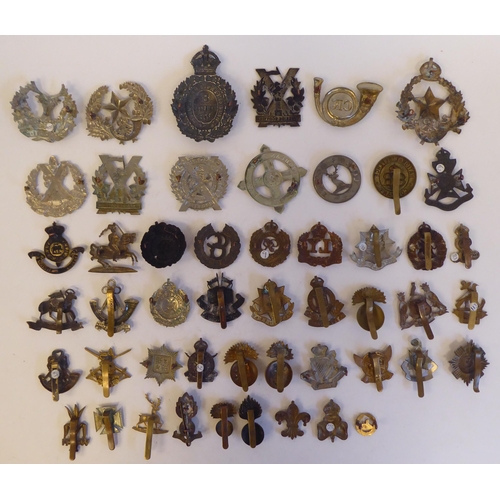 269 - Approximately fifty military metal cap badges, some copies: to include 'The Kings Liverpool Regiment... 