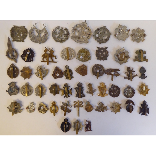 271 - Approximately fifty military metal cap badges, some copies: to include 'Cheshire Regiment'(Please No... 