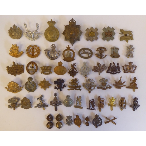 275 - Approximately fifty military metal cap badges, some copies: to include 'Cardiff Regiment'(Please Not... 