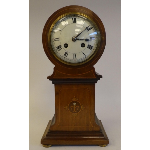 279 - An Edwardian string inlaid mantel clock of tower form, on a plinth and bun feet; the movement faced ... 