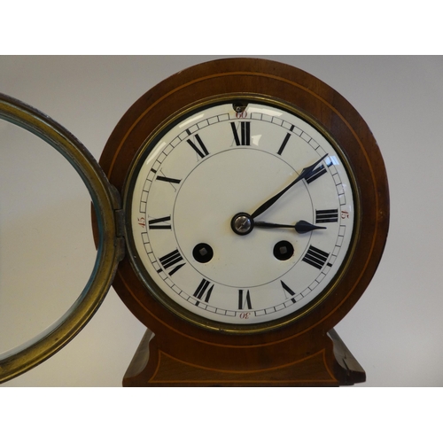 279 - An Edwardian string inlaid mantel clock of tower form, on a plinth and bun feet; the movement faced ... 