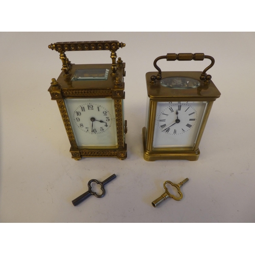 281 - Two 20thC lacquered brass and bevelled glass cased carriage timepieces, one faced by a Roman dial, t... 