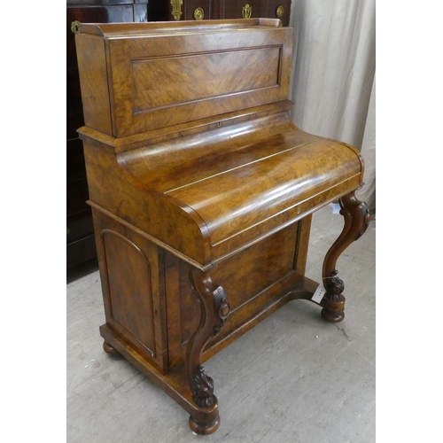 293 - A late Victorian walnut piano Davenport, the box top section with a rising panel, enclosing a pigeon... 