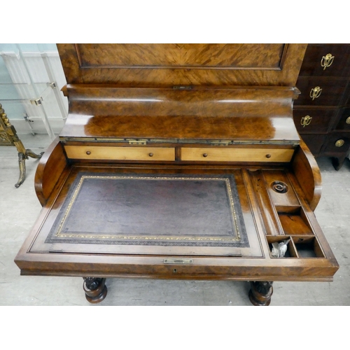 293 - A late Victorian walnut piano Davenport, the box top section with a rising panel, enclosing a pigeon... 