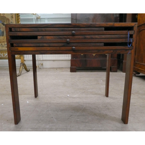 294 - A mid 20thC Scandinavian Illum Wikkelso rosewood side table, housing three folding tables, raised on... 