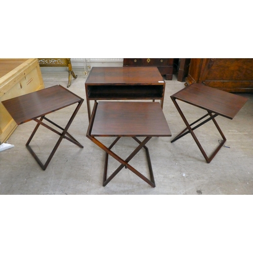 294 - A mid 20thC Scandinavian Illum Wikkelso rosewood side table, housing three folding tables, raised on... 