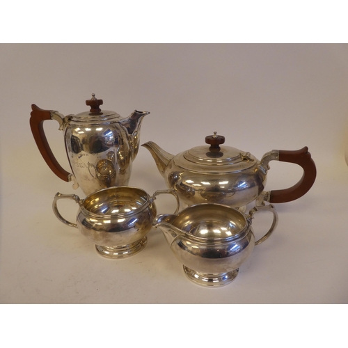 296 - A George VI four piece silver tea set, comprising a teapot, coffee pot, cream jug and sugar basin  M... 