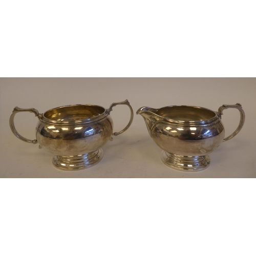 296 - A George VI four piece silver tea set, comprising a teapot, coffee pot, cream jug and sugar basin  M... 