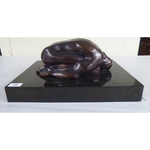 58 - Ayonso - a bronze male nude sculpture  bears a signature & dated '73 on a fixed plinth ... 