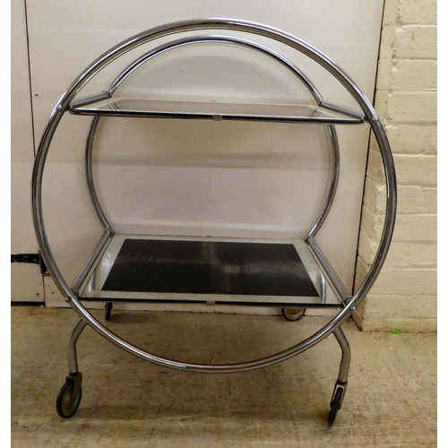 60 - A reproduction of an Art Deco inspired, chromium plated, framed and glazed, two tier hostess trolley... 