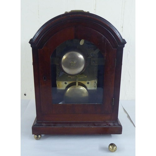 71 - A circa George III mahogany cased mantel clock; the chain driven bell strike movement faced by a Rom... 