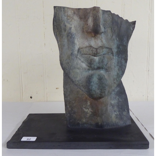 82 - Shaun Brosnan - 'Face Fragment V'  beaten metal, on a plinth  15