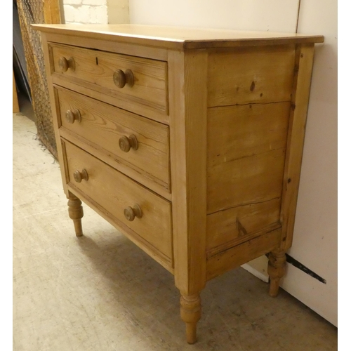 90 - An early 20thC pine, three drawer dressing chest, raised on turned legs  32