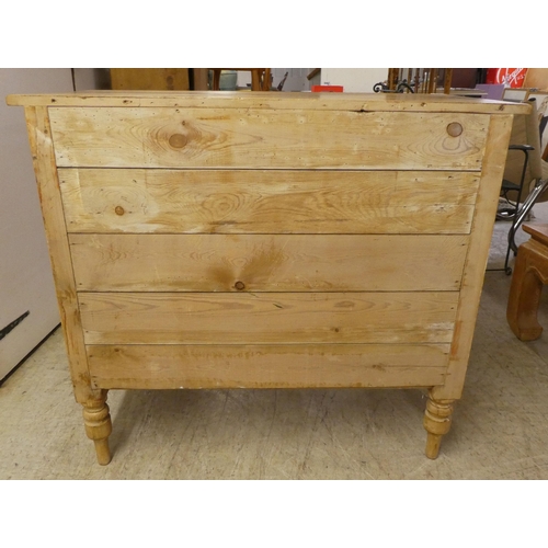 90 - An early 20thC pine, three drawer dressing chest, raised on turned legs  32