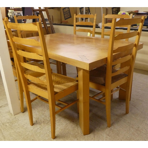 92 - A modern beech kitchen table, raised on square legs  29