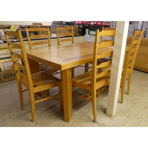 92 - A modern beech kitchen table, raised on square legs  29