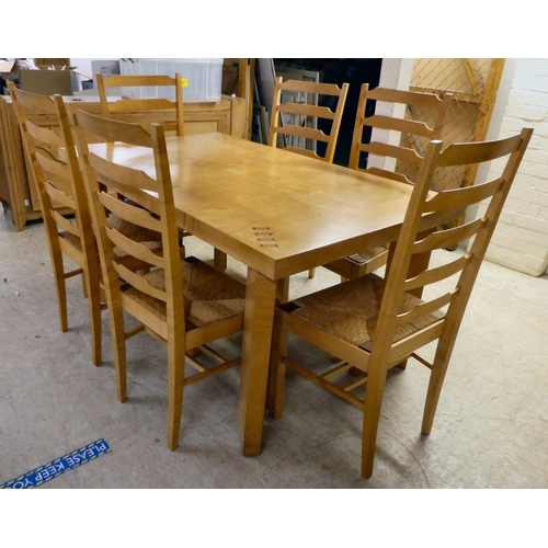 92 - A modern beech kitchen table, raised on square legs  29