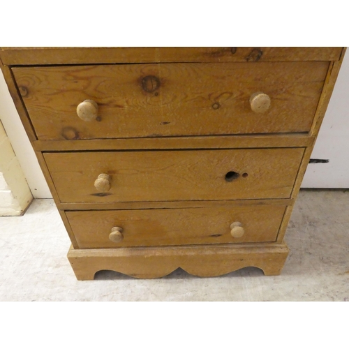 93 - An early/mid 20thC pine, six drawer tall boy, raised on a bracket plinth  42