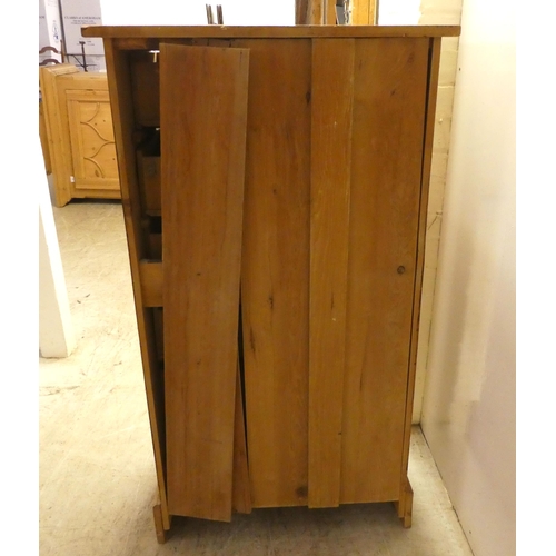 93 - An early/mid 20thC pine, six drawer tall boy, raised on a bracket plinth  42