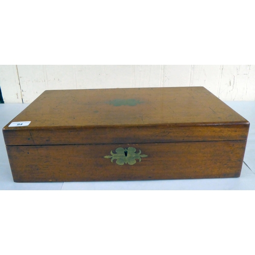 94 - A mid Victorian mahogany writing slope with straight sides and hinged lid, enclosing a part-fitted i... 