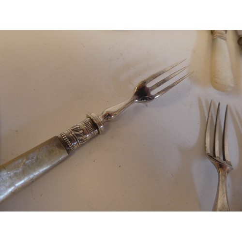 171 - A set of ten silver plated fruit knives and forks with mother-of-pearl handles