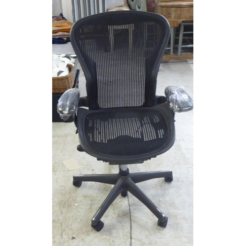 126 - A Herman Miller Aeron design, swivel office chair, raised on casters