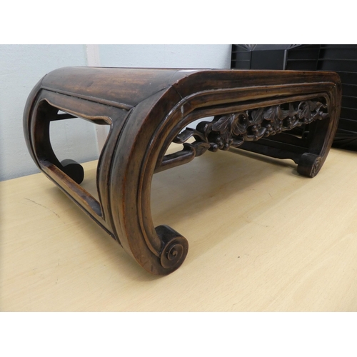 136 - An early 20thC Chinese rosewood ceremonial table with a leaf and berry carved frieze, raised on curv... 