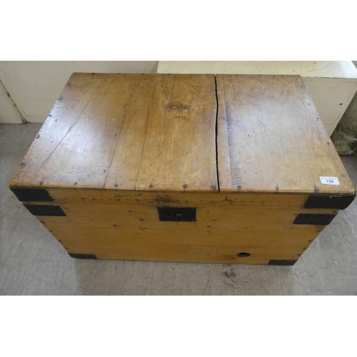 139 - A late Victorian pine blanket chest with a hinged lid and opposing handles, on a plinth  17