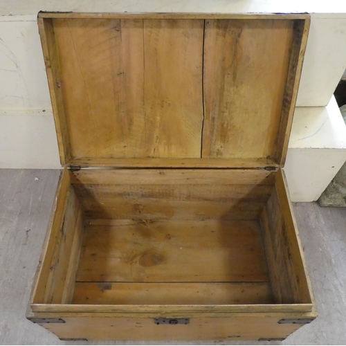 139 - A late Victorian pine blanket chest with a hinged lid and opposing handles, on a plinth  17