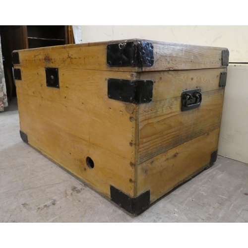 139 - A late Victorian pine blanket chest with a hinged lid and opposing handles, on a plinth  17