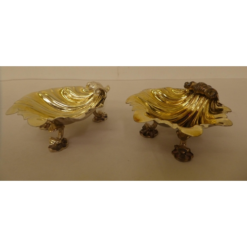 182 - A pair of silver gilt salt cellars of shell design, on cornucopia design feet  London 1837 and a pai... 