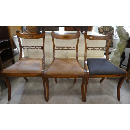 189 - A set of eight Early 19th Century faux satinwood dining chairs, each with a double scrolled crest an... 