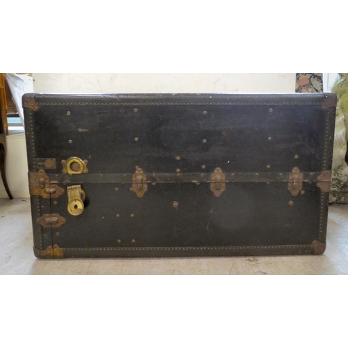 192 - An early 20thC Oshkosh travel trunk with a fitted interior  41