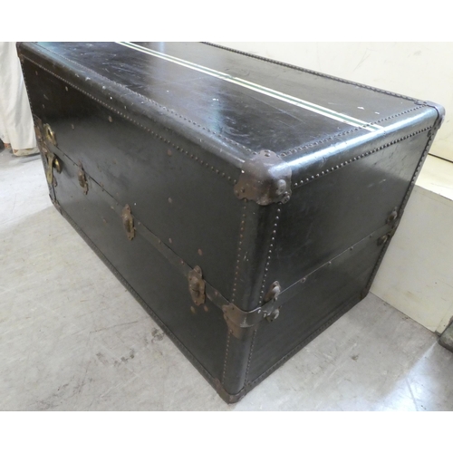 192 - An early 20thC Oshkosh travel trunk with a fitted interior  41