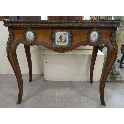 195 - A mid 19thC marquetry walnut, serpentine front card table with a foldover top, the frieze set with p... 