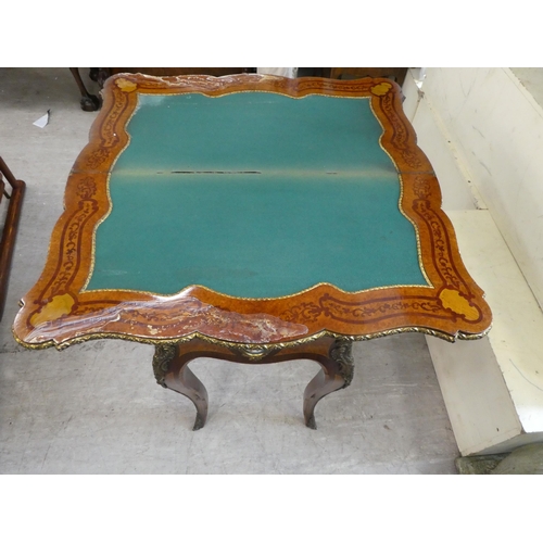 195 - A mid 19thC marquetry walnut, serpentine front card table with a foldover top, the frieze set with p... 